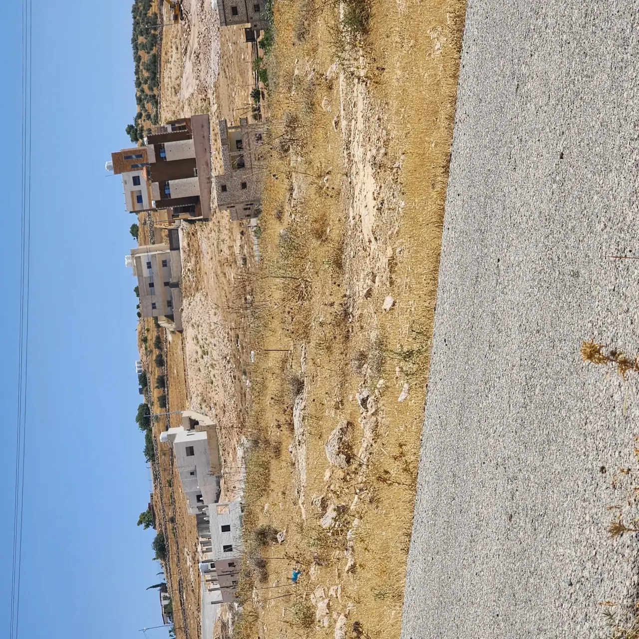 695 m² zone B plot in Rajm Al Shawk, 700 m from Shafa Badran, corner of two 12 m streets