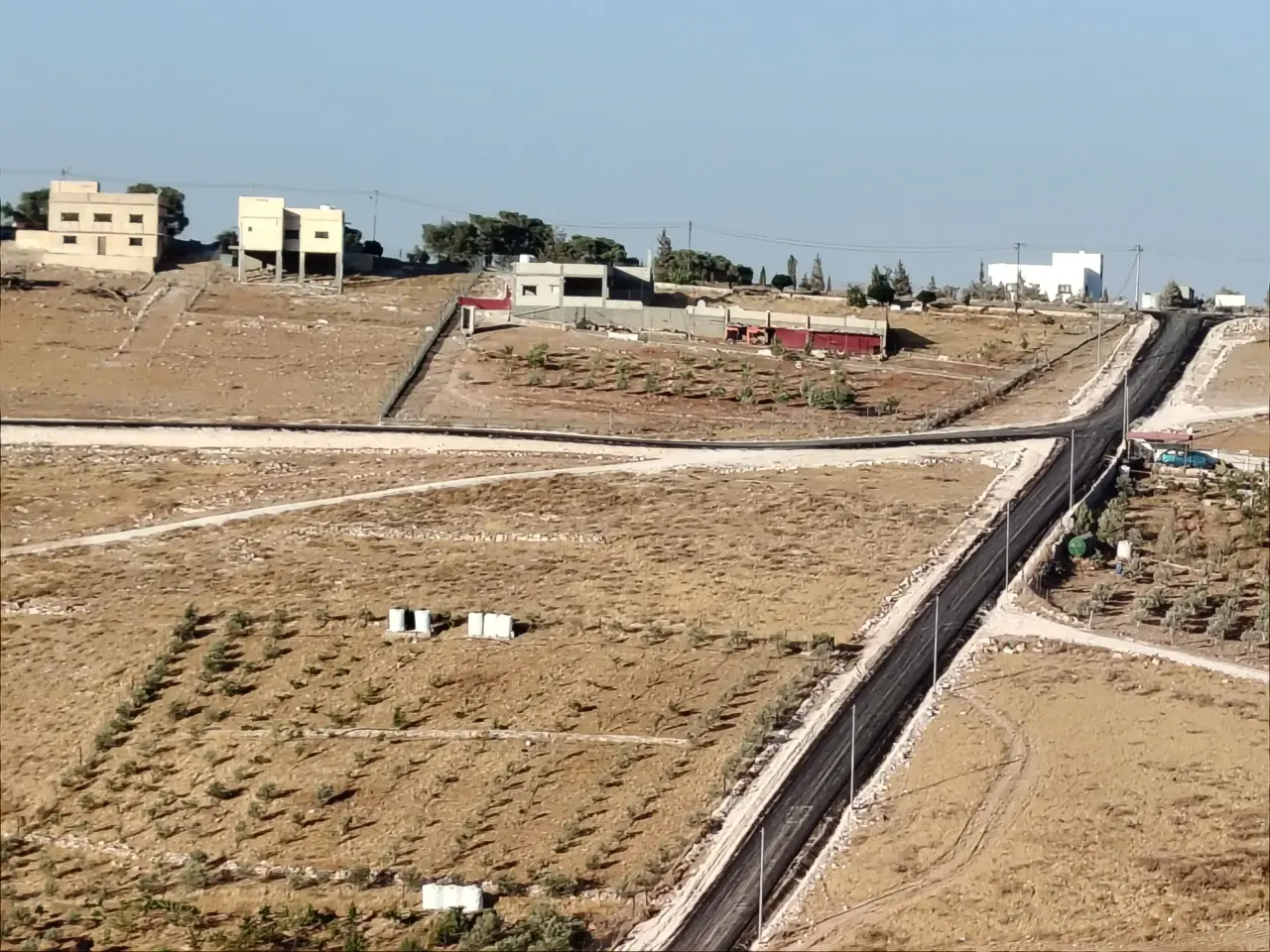 Three paved streets around a 3.4-dunum plot in Bala'ama, Hamnana, Mafraq