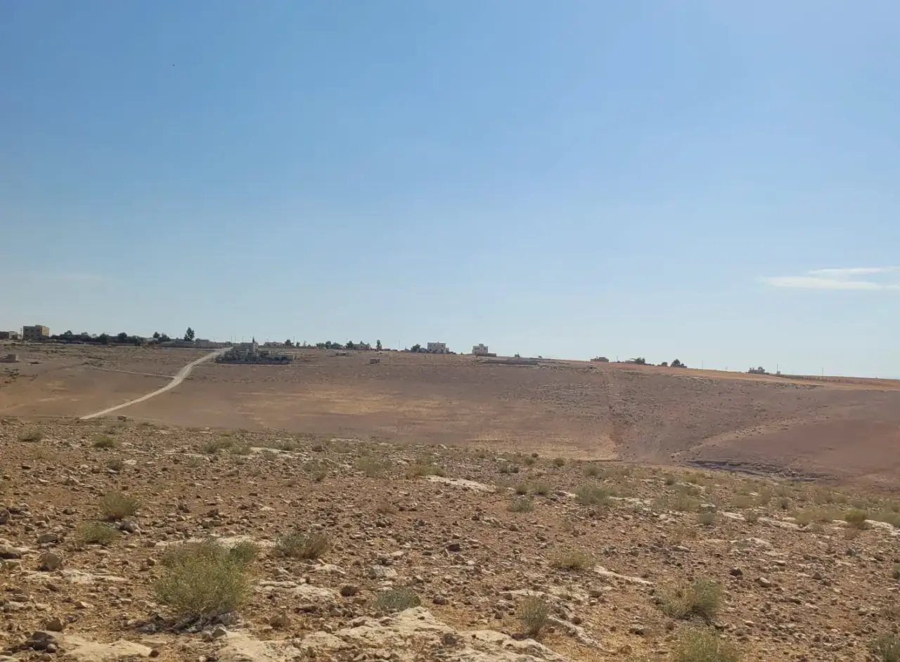 Raised 3.65-dunum plot with a view for sale in Al-Zafaran, south Amman, suits a chalet or farm