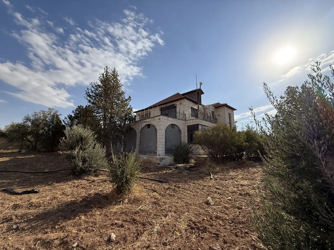 Near Airport Road in Umm Al-Amad, a two-storey country villa on 4 dunums