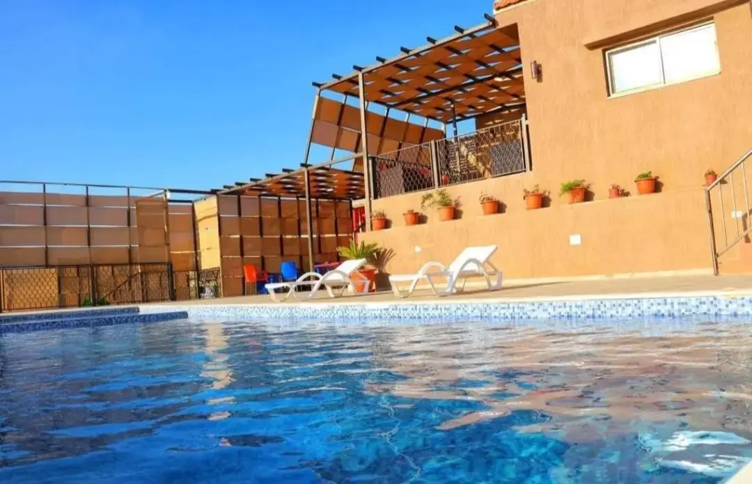 Two chalets and two pools on a 5-dunum farm for sale in Birayn