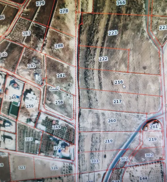 Level 6.4-dunum plot in Al-Kamsha with panoramic views, on two streets
