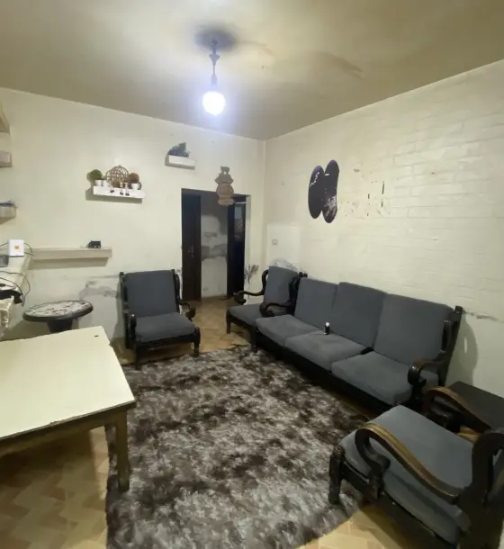 Home or clinic on a Jabal Al Nuzha main road: ground-floor apartment with terrace