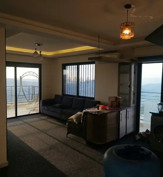 Semi-furnished 3-bedroom apartment with open views for rent in Hay Al Muhandiseen, Abu Nsair