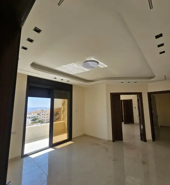 Lift, garage, never lived in: new 3-bed flat for rent in Abu Al-Sous