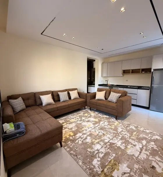 Furnished rooftop apartment with a large terrace for rent near Airport Road, Dahiet Al Ameer Ali