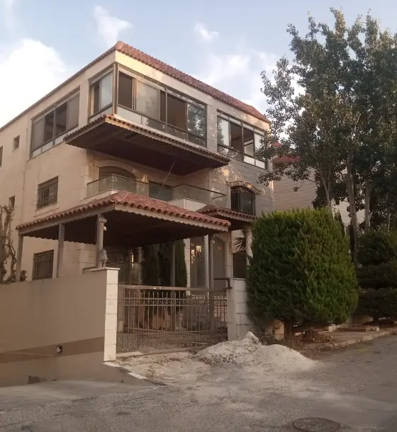 Three-storey villa with indoor pool for sale in Dahyet Al Nakheel, near Airport Road