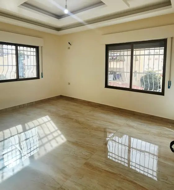 New 100 m² ground-floor apartment with private garage for sale in Jabal Al Zohor