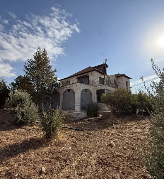 Near Airport Road in Umm Al-Amad, a two-storey country villa on 4 dunums