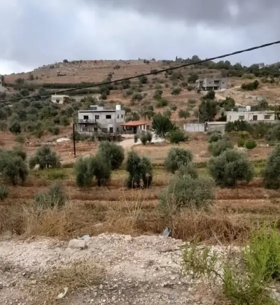 Nearly 2 dunums with trees on a 30 m road between Kufrkhal and Sakhra